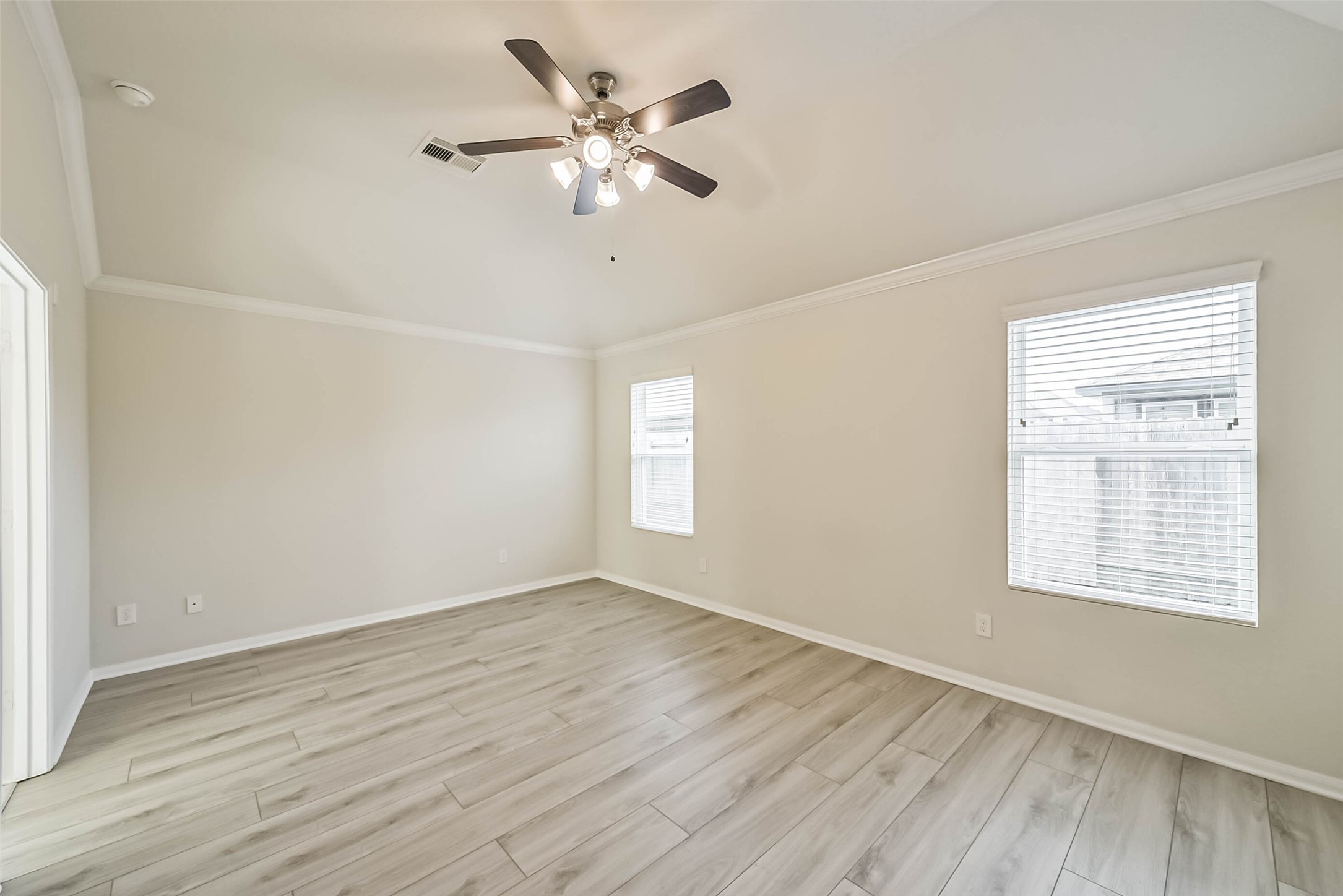 2630 Zephyr Lane Rosenberg, TX 77471 - Photo 18 of 33 wooden floor in an empty room with a window