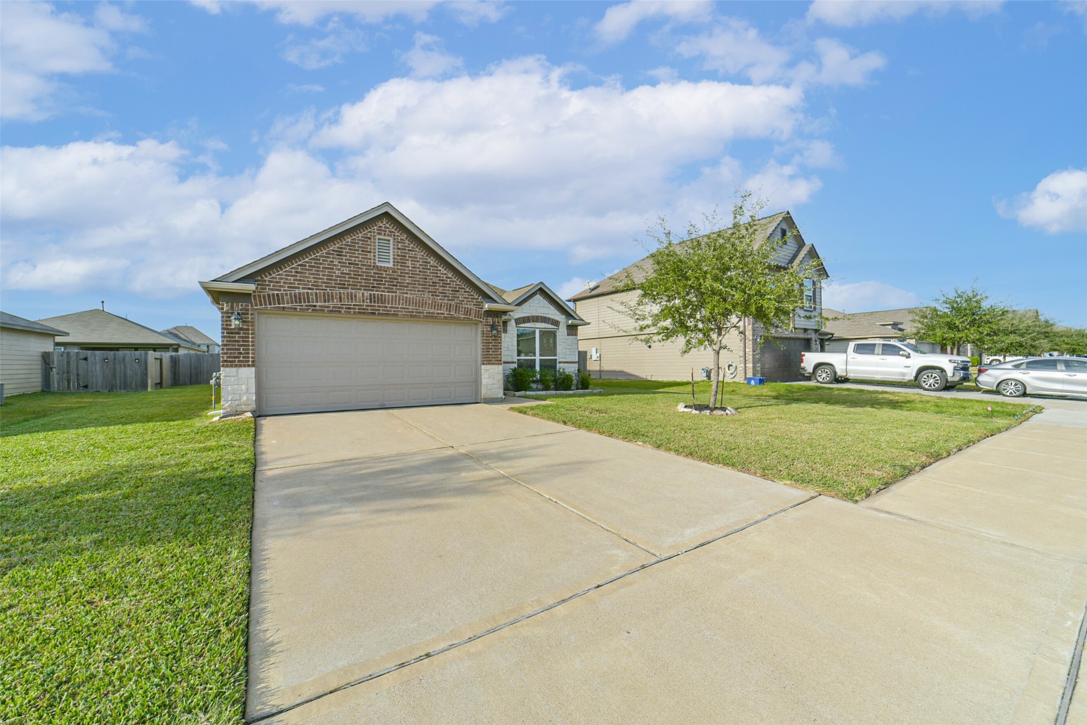 2630 Zephyr Lane Rosenberg, TX 77471 - Photo 2 of 33 a front view of a house with a yard and garage