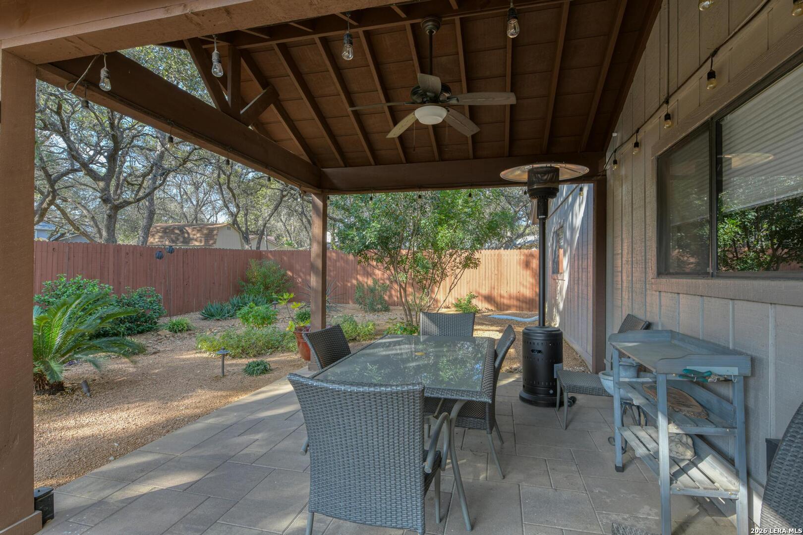 3154 Morning Trail San Antonio, TX 78247 - Photo 16 of 41 a view of an outdoor dining space with a table and chairs
