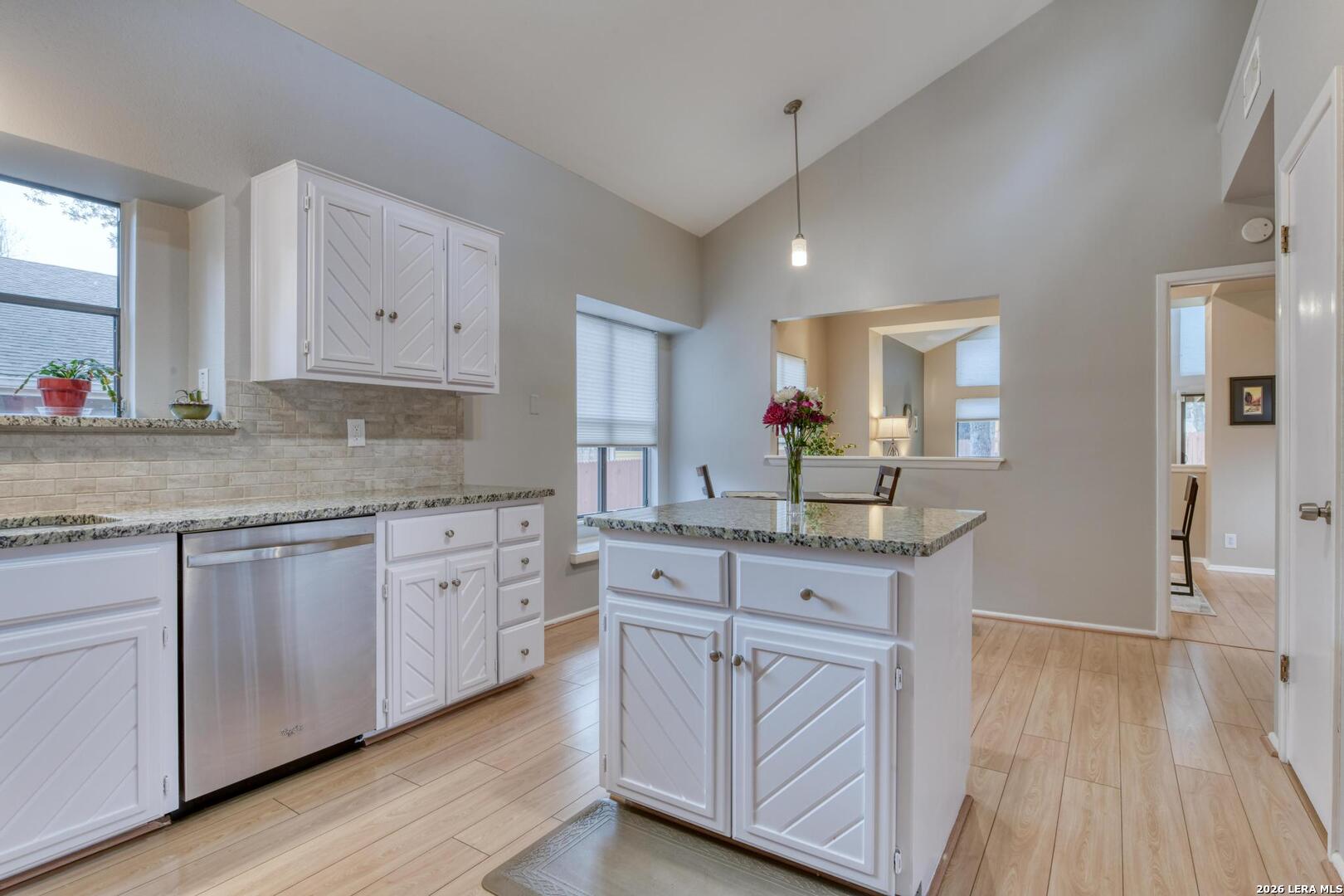 3154 Morning Trail San Antonio, TX 78247 - Photo 29 of 41 a kitchen with granite countertop white cabinets and white appliances