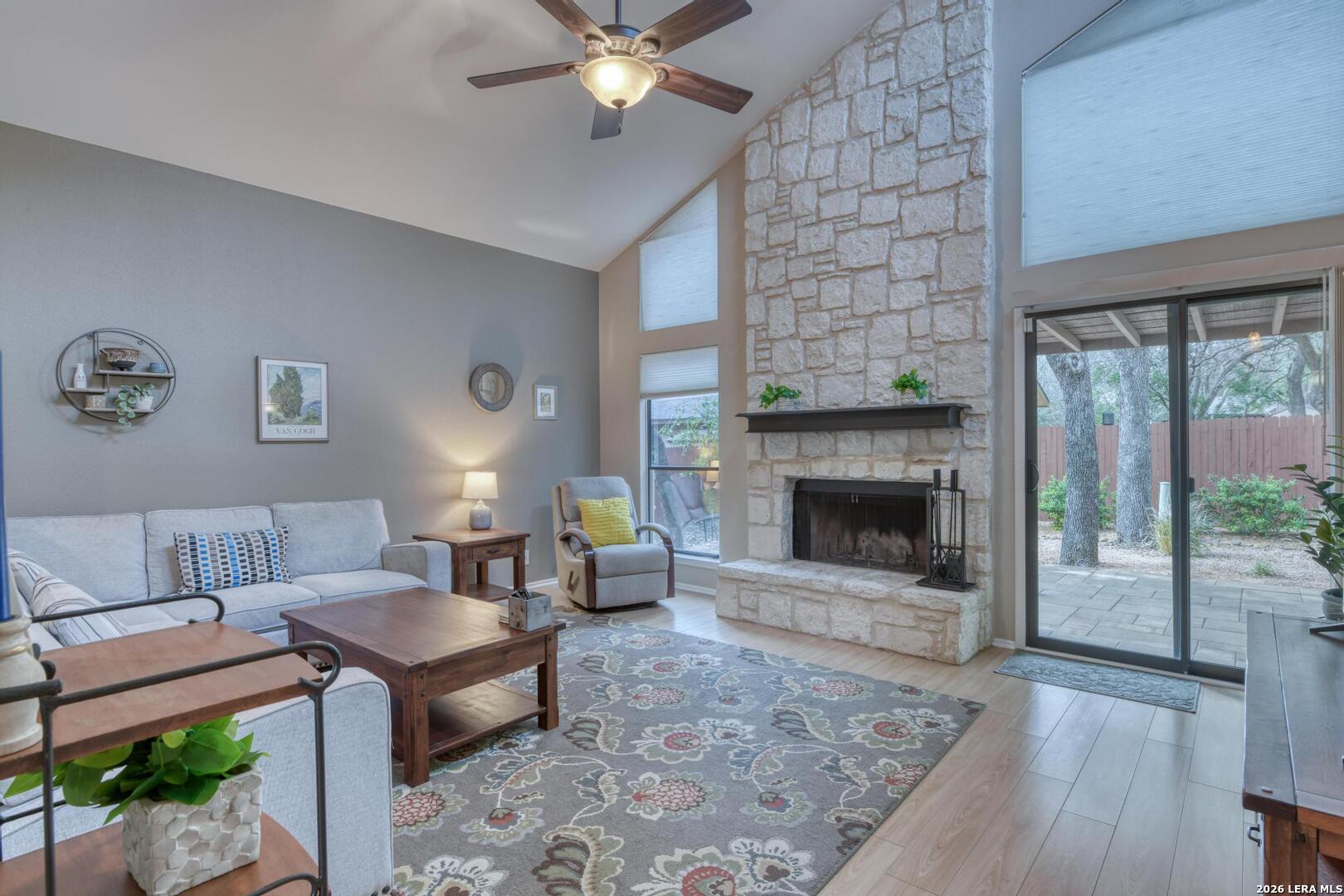 3154 Morning Trail San Antonio, TX 78247 - Photo 3 of 41 a living room with furniture a window and a fireplace