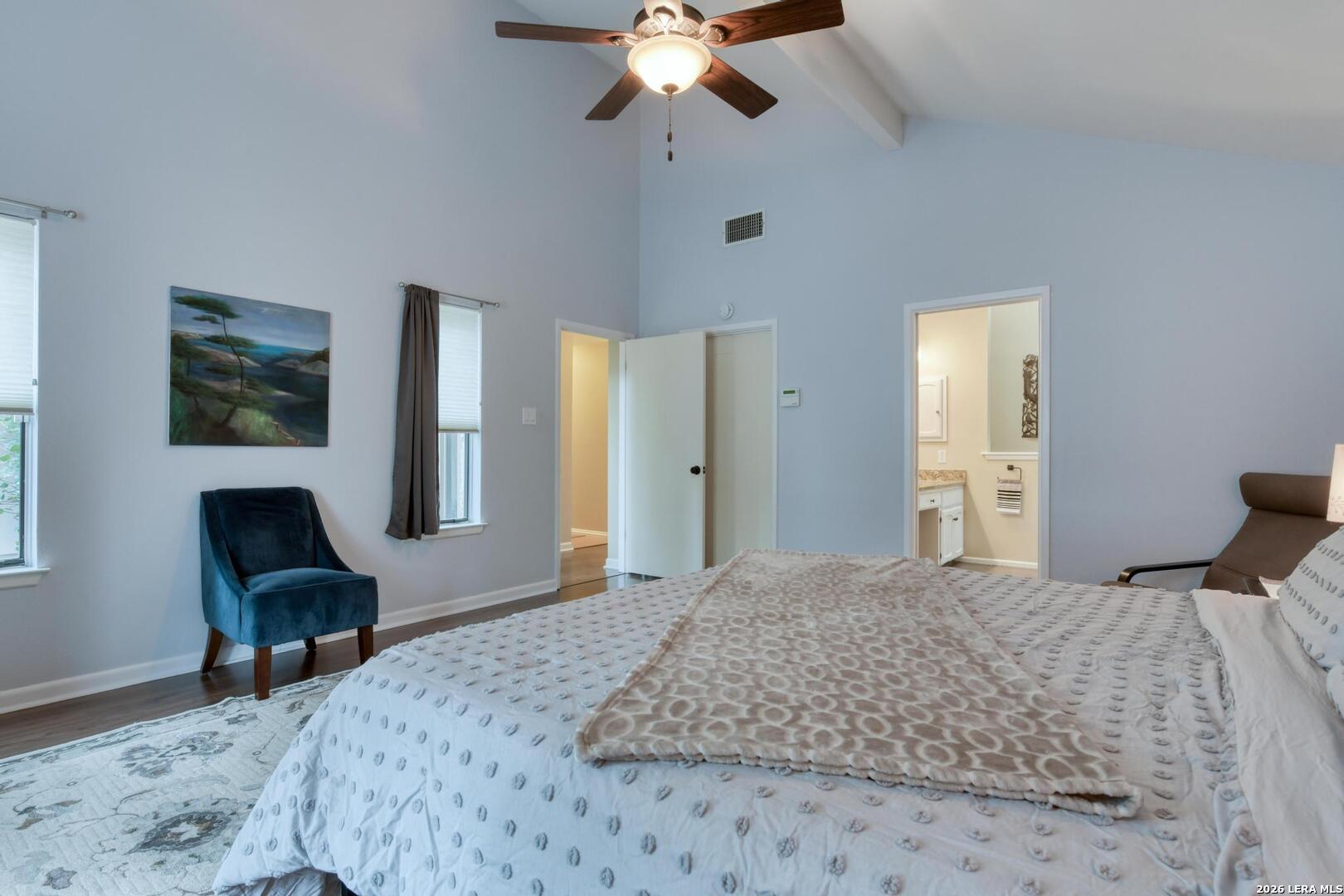 3154 Morning Trail San Antonio, TX 78247 - Photo 31 of 41 a bedroom with a bed and a chandelier