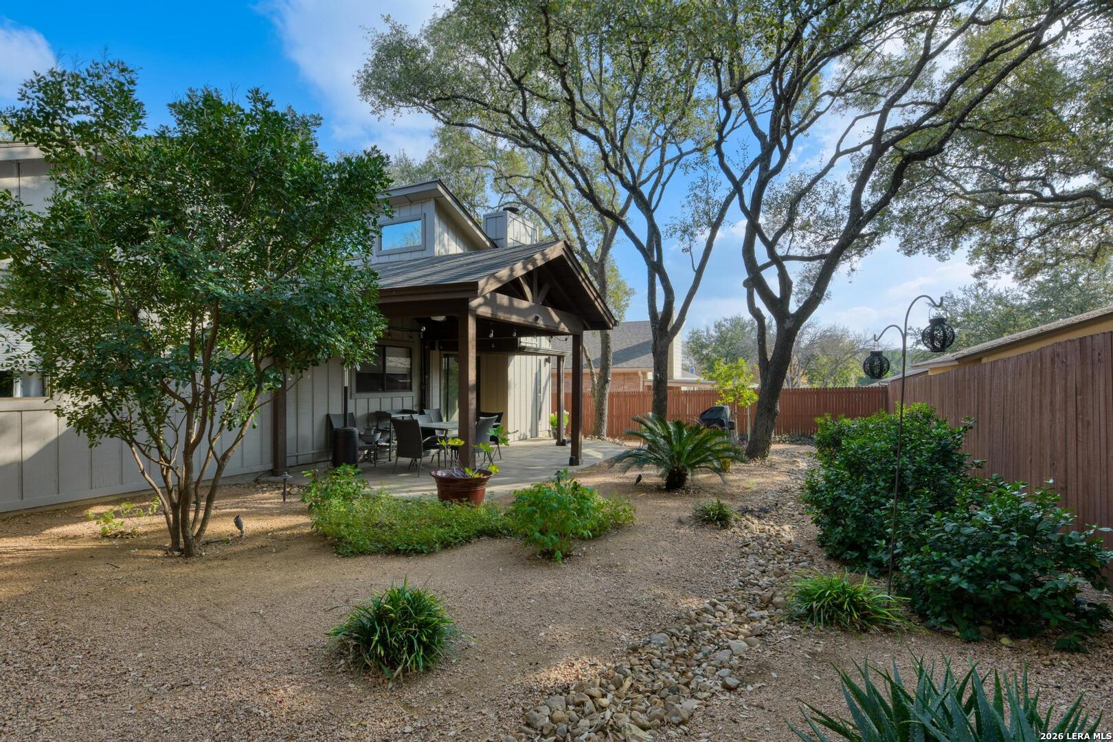 3154 Morning Trail San Antonio, TX 78247 - Photo 40 of 41 a front view of a house with garden and trees