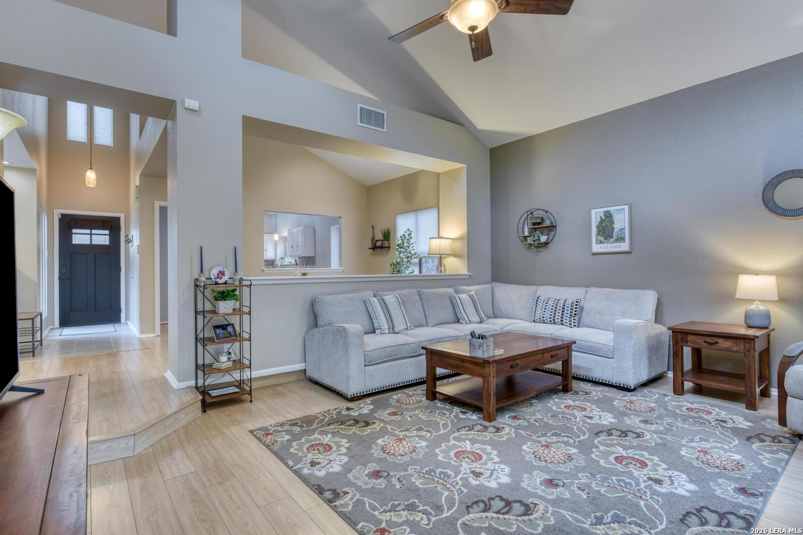 3154 Morning Trail San Antonio, TX 78247 - Photo 6 of 41 a living room with furniture and a chandelier