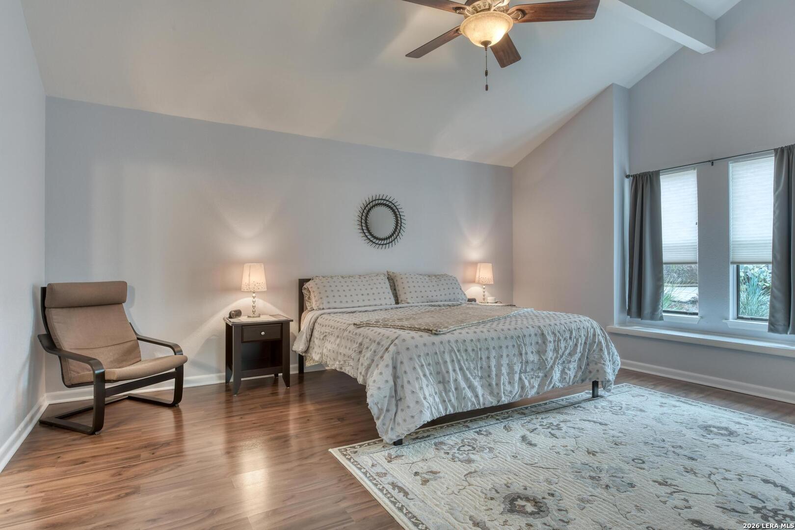 3154 Morning Trail San Antonio, TX 78247 - Photo 10 of 41 a bedroom with a bed a chair and a chandelier