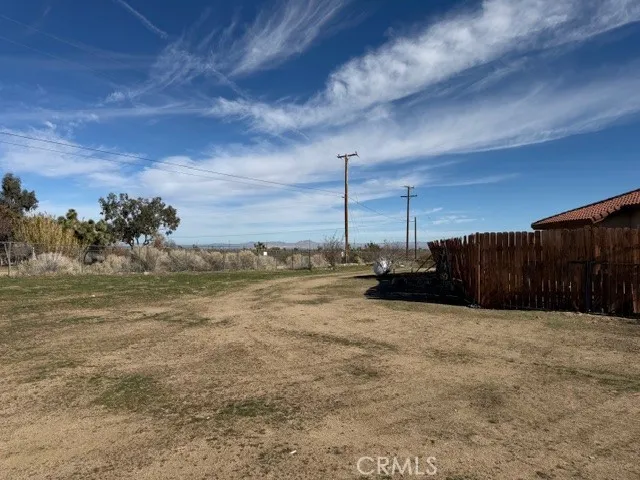 a view of a backyard of the house