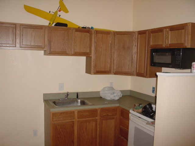 4555 Carter Road St. Augustine, FL 32086 - Photo 13 of 14 a kitchen with stainless steel appliances a sink a stove a microwave a refrigerator a cabinets and wooden floor