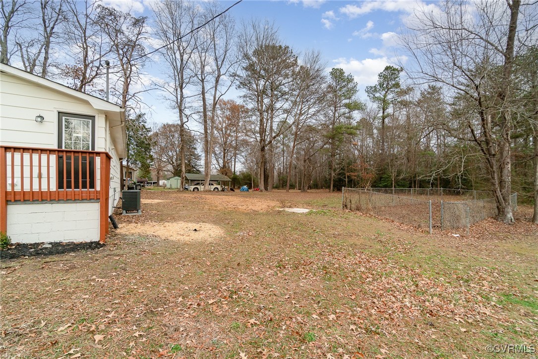 19256 Perimeter Road Milford, VA 22514 - Photo 23 of 29 View of yard with central air condition unit