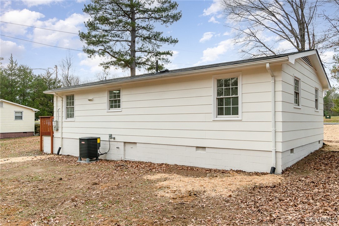 19256 Perimeter Road Milford, VA 22514 - Photo 24 of 29 View of home's exterior featuring central AC unit