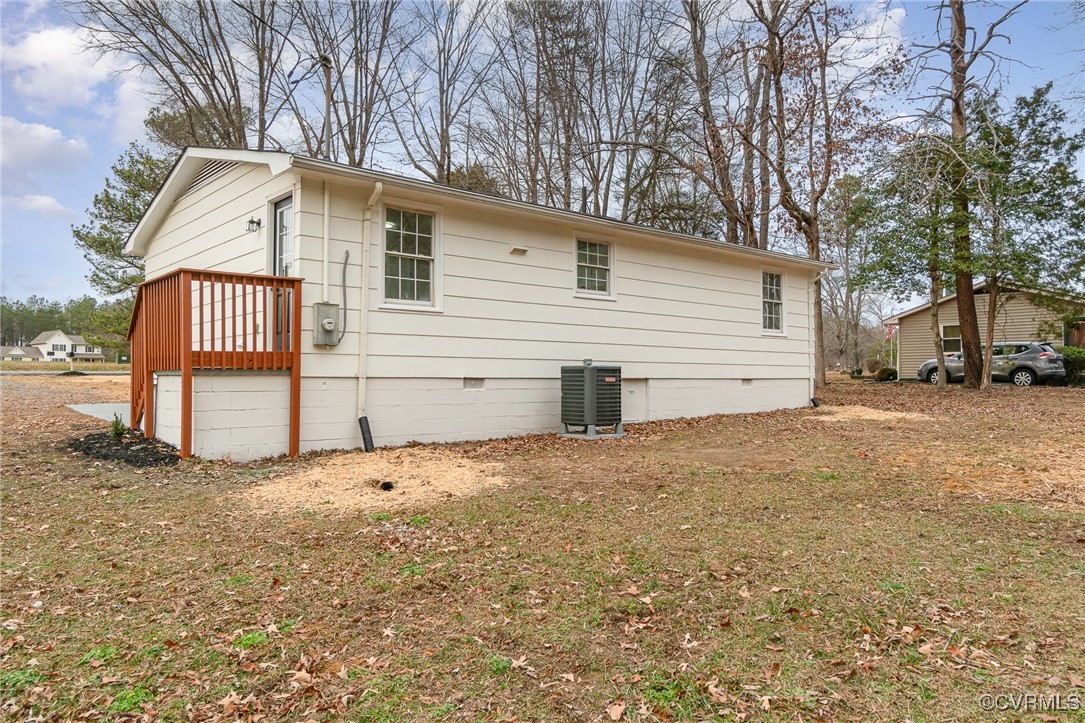19256 Perimeter Road Milford, VA 22514 - Photo 25 of 29 Rear view of house featuring central AC
