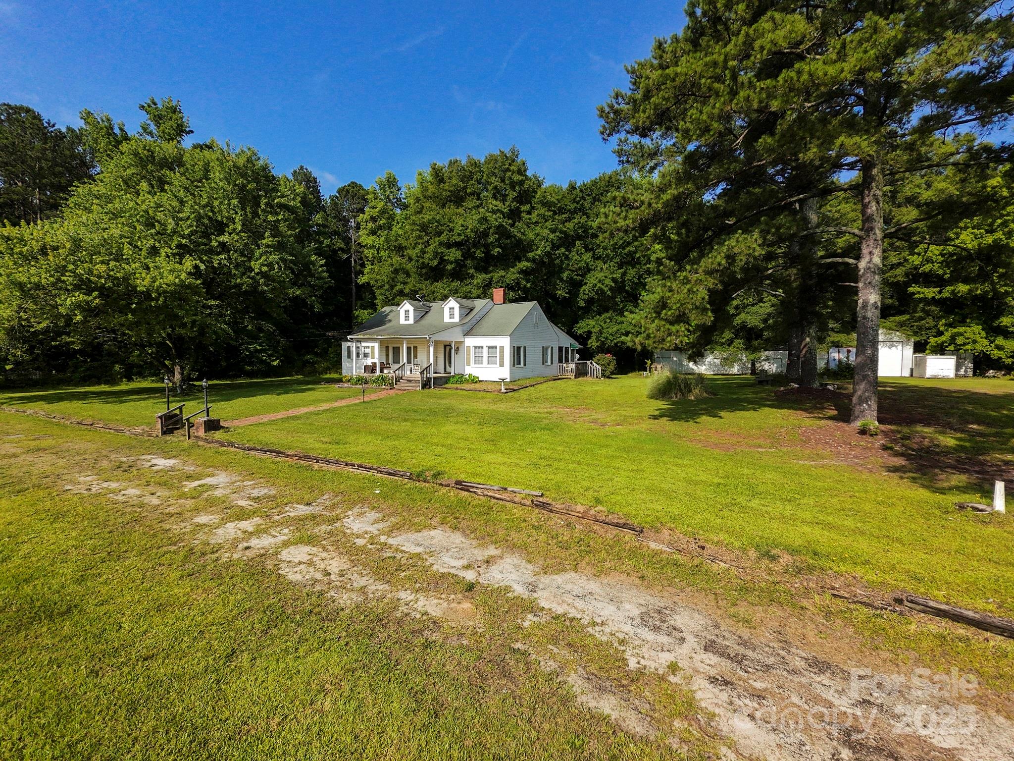 3390 Highway 151 Pageland, SC 29728 - Photo 2 of 11 a view of a swimming pool with an outdoor space and seating area