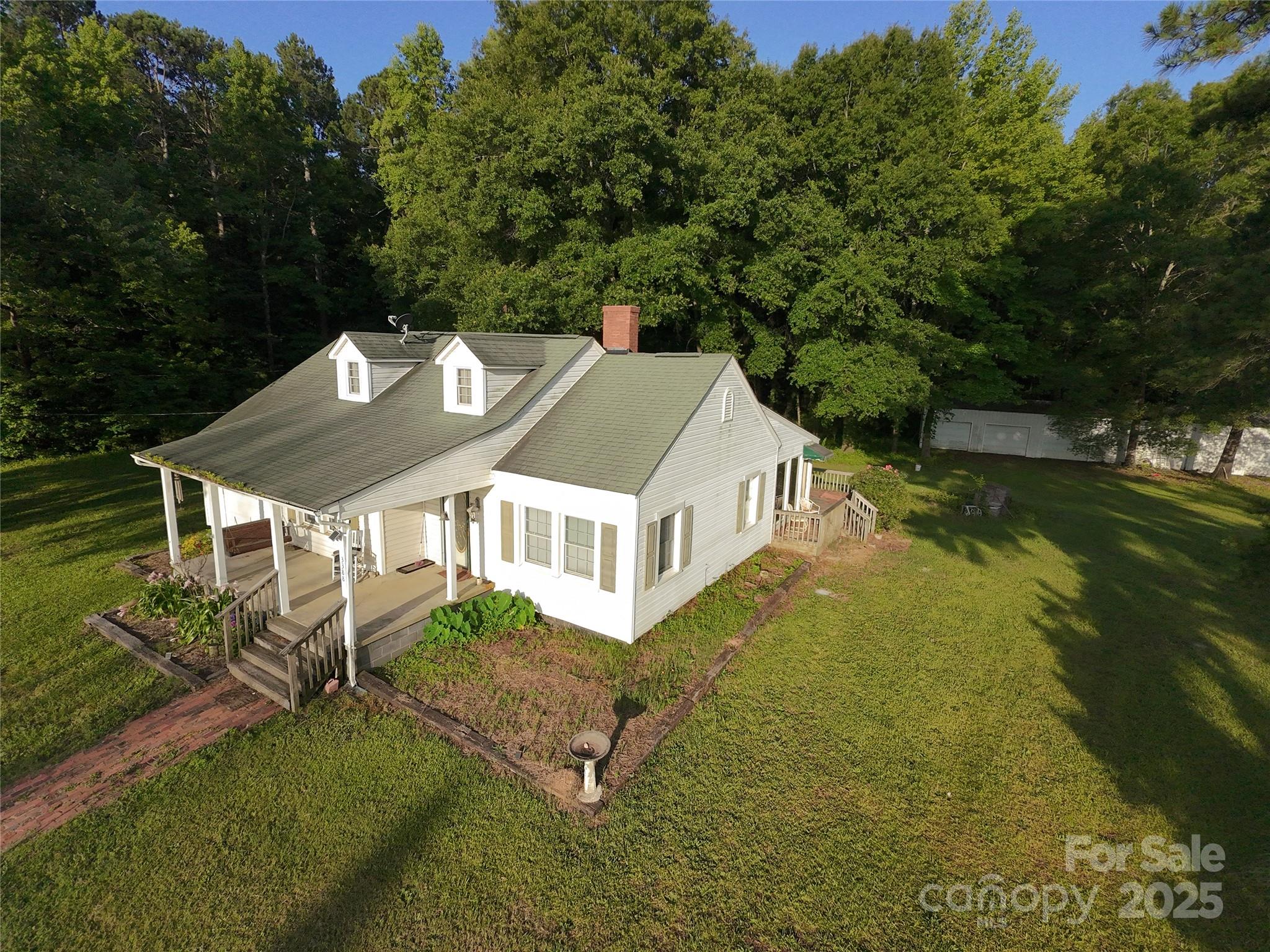 3390 Highway 151 Pageland, SC 29728 - Photo 4 of 11 an aerial view of a house with a yard