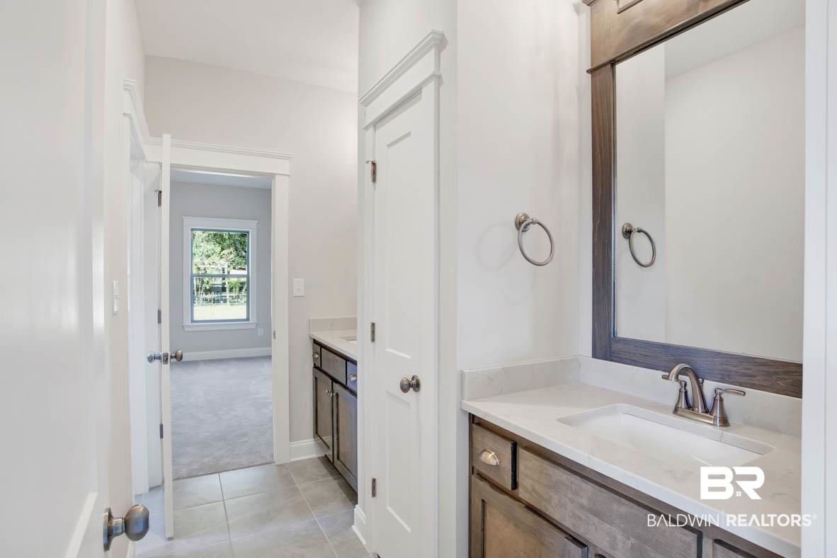 393 Garrison Boulevard Fairhope, AL 36532 - Photo 21 of 40 Bathroom featuring tile patterned floors and vanity