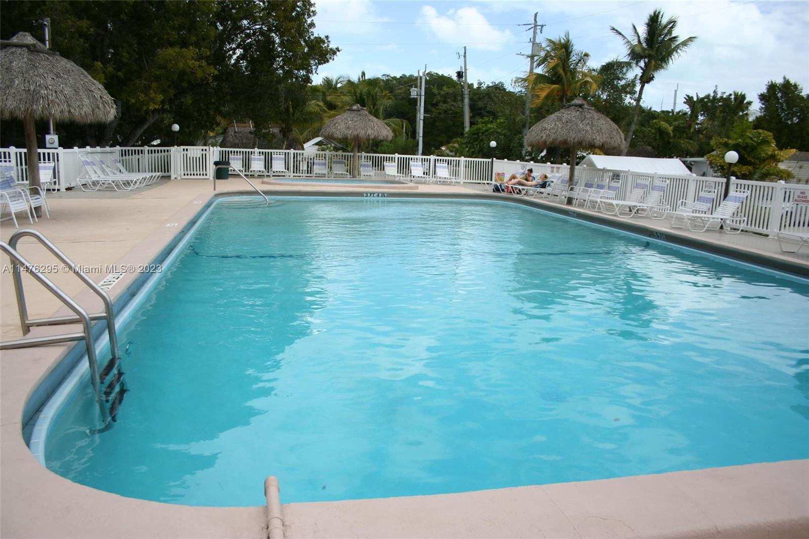 Key Largo Key Largo, FL 33037 - Photo 9 of 18 a view of a swimming pool with a patio
