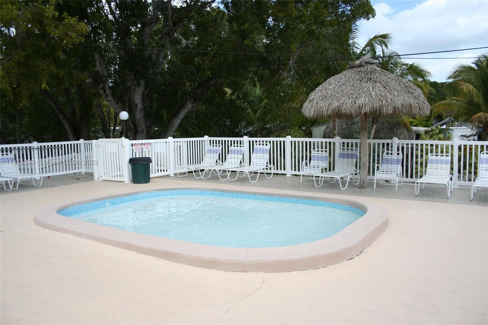 Key Largo Key Largo, FL 33037 - Photo 10 of 18 a view of a swimming pool with a patio