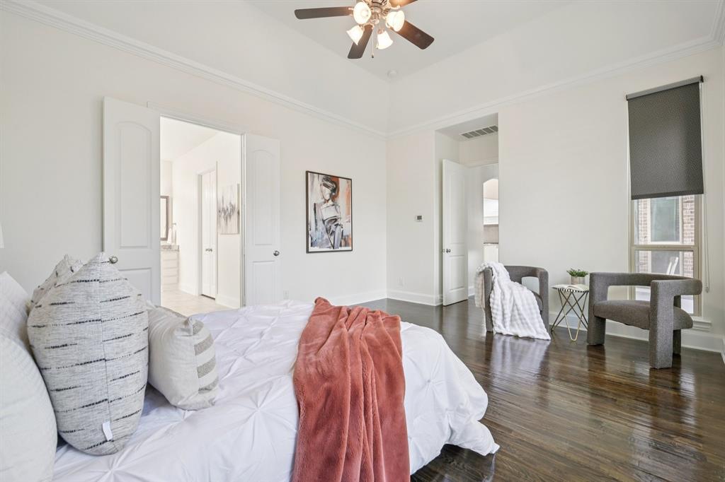 2029 Temperate Drive Allen, TX 75013 - Photo 13 of 40 a spacious bedroom with a bed and a table