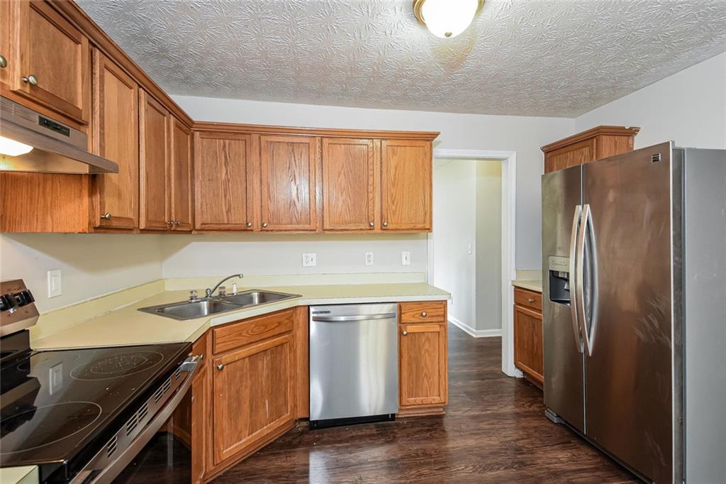 3328 River Run Trail Decatur, GA 30034 - Photo 11 of 20 a kitchen with a sink a refrigerator and cabinets