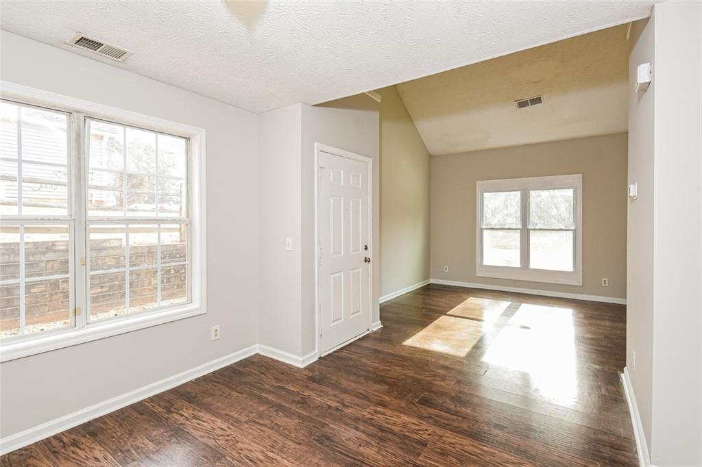3328 River Run Trail Decatur, GA 30034 - Photo 12 of 20 a view of an empty room with wooden floor and a window