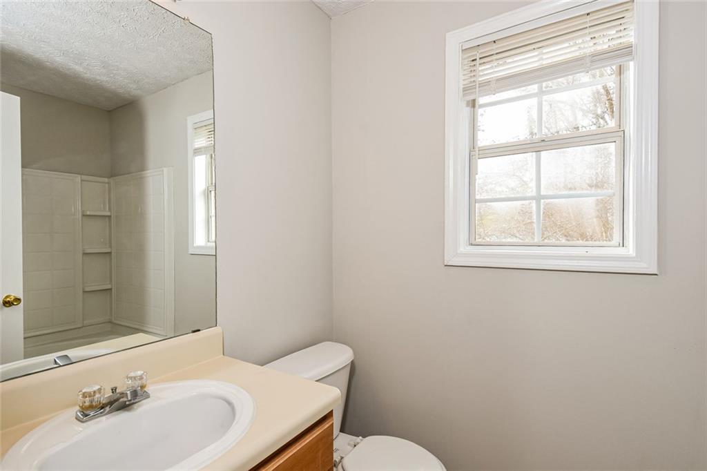 3328 River Run Trail Decatur, GA 30034 - Photo 14 of 20 a bathroom with a sink mirror toilet and next to a window