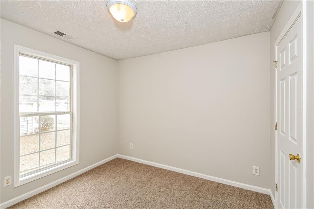 3328 River Run Trail Decatur, GA 30034 - Photo 16 of 20 an empty room with windows and closet