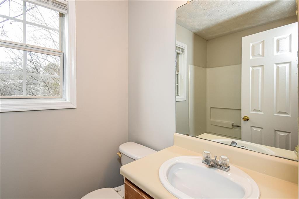 3328 River Run Trail Decatur, GA 30034 - Photo 18 of 20 a bathroom with a sink mirror and a toilet