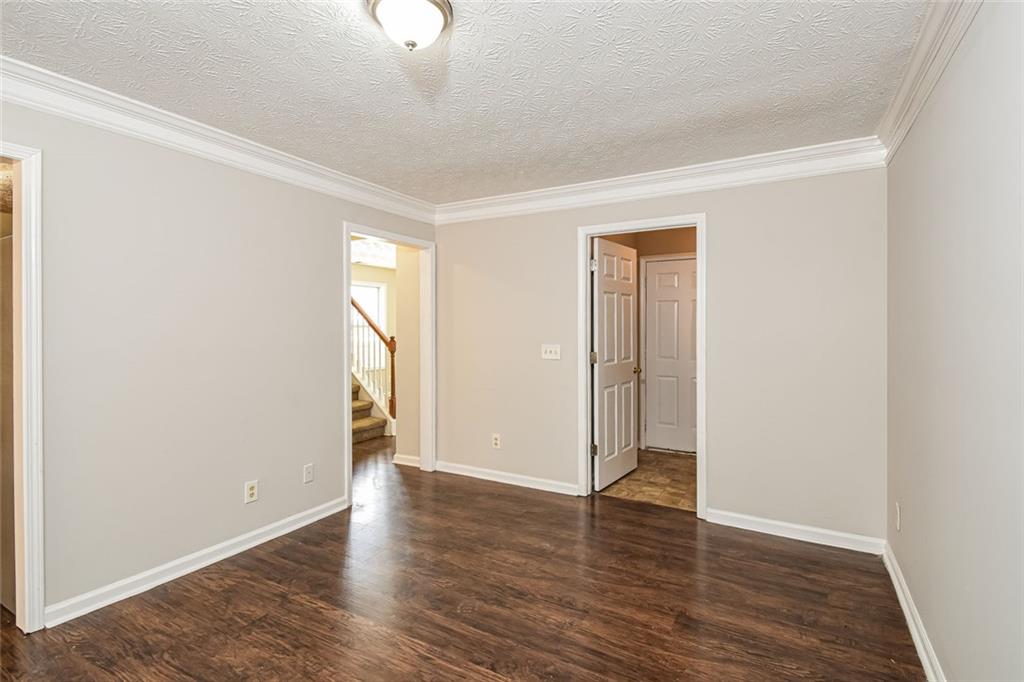 3328 River Run Trail Decatur, GA 30034 - Photo 3 of 20 an empty room with wooden floor and mirror