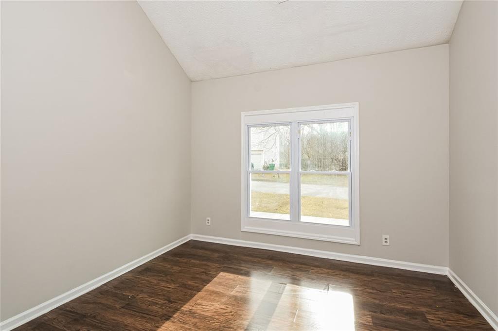 3328 River Run Trail Decatur, GA 30034 - Photo 4 of 20 an empty room with wooden floor and windows