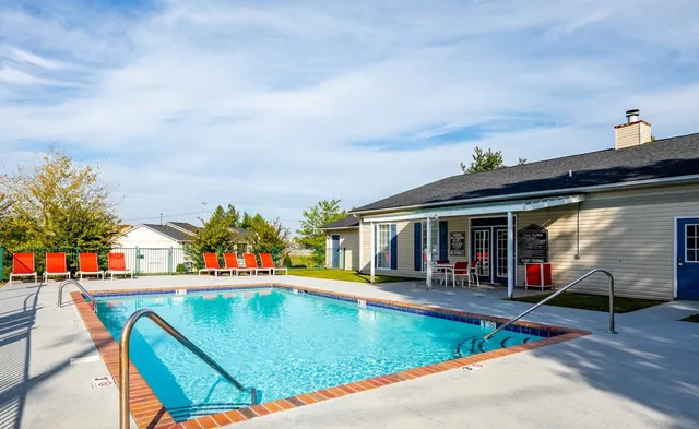 swimming pool view with seating space