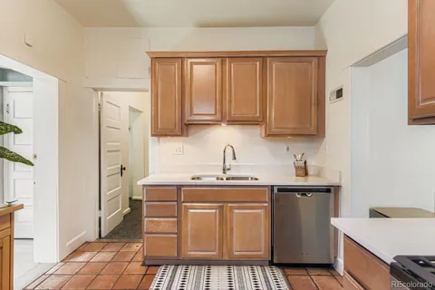 a kitchen with stainless steel appliances a refrigerator and a stove