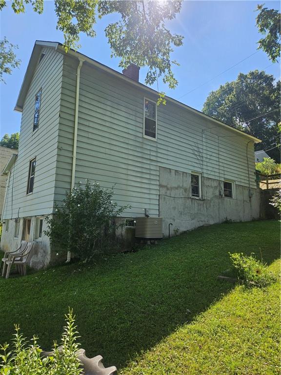 113 Hillside Way New Castle, PA 16101 - Photo 3 of 18 a view of a back yard of the house