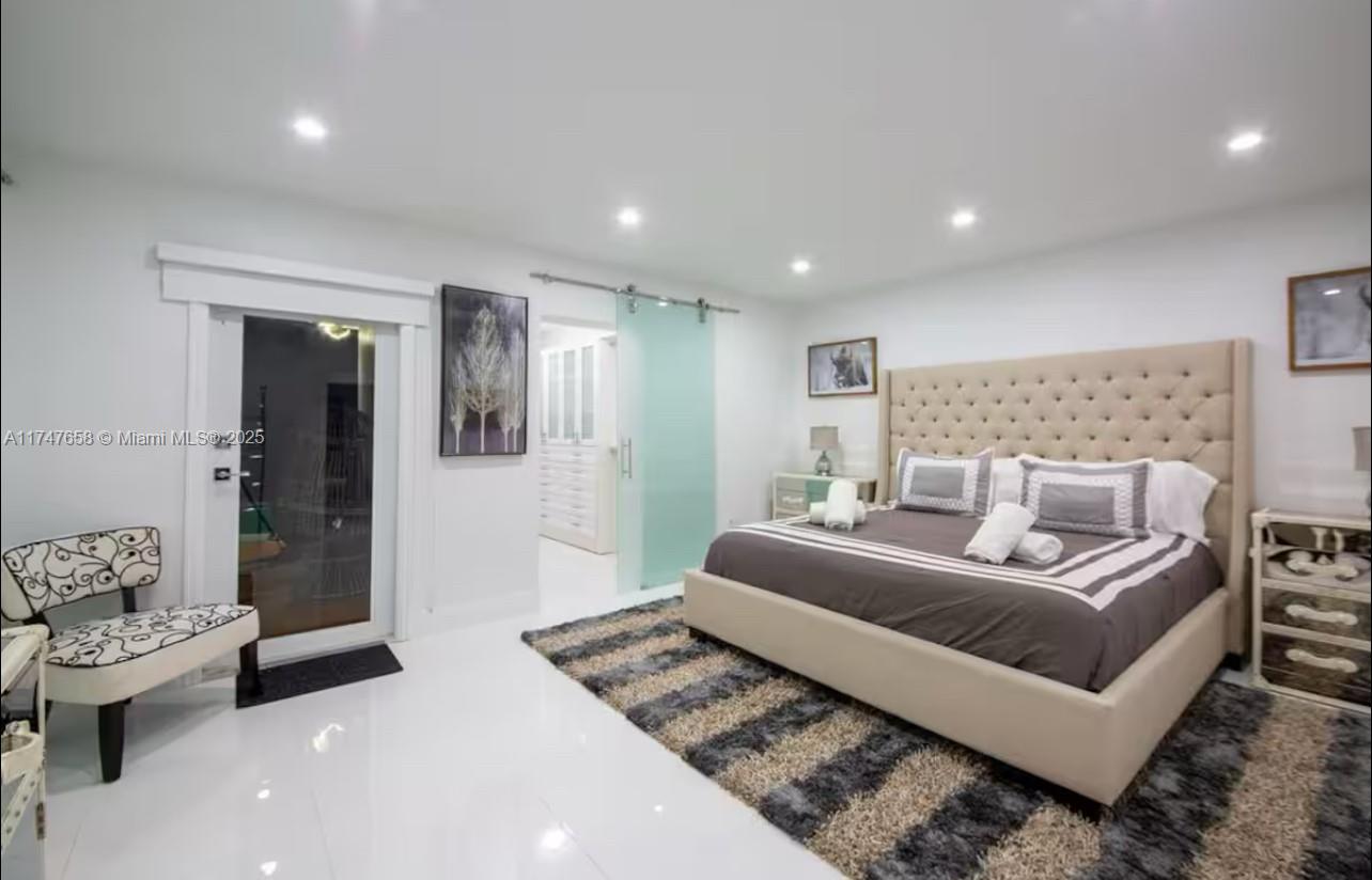 2271 Northeast 191st Street Miami, FL 33180 - Photo 16 of 24 a living room with furniture and a couch