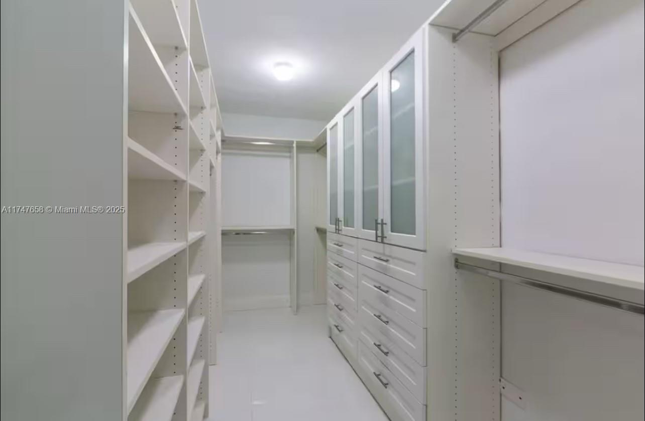 2271 Northeast 191st Street Miami, FL 33180 - Photo 17 of 24 a view of walk in closet