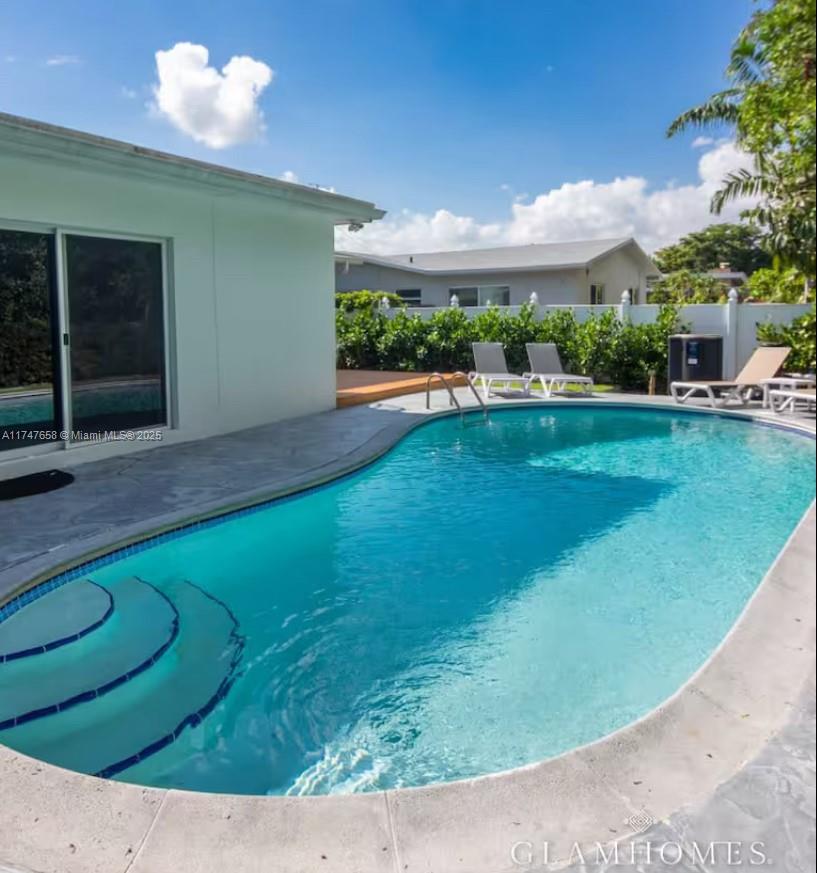 2271 Northeast 191st Street Miami, FL 33180 - Photo 4 of 24 a view of a fountain in front of a house