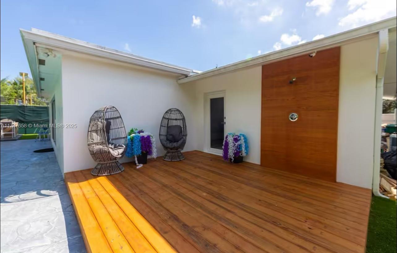 2271 Northeast 191st Street Miami, FL 33180 - Photo 6 of 24 a view of a room with wooden floor and furniture
