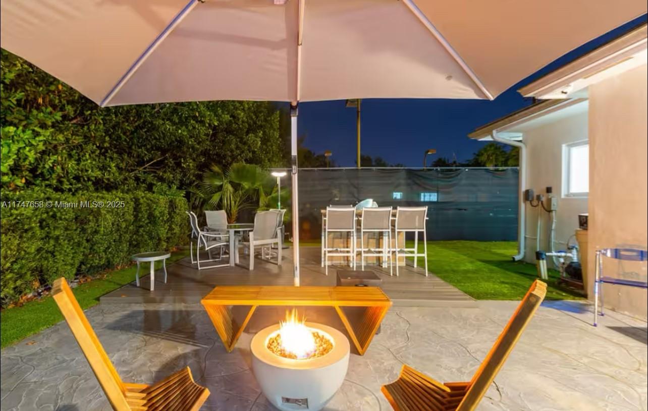 2271 Northeast 191st Street Miami, FL 33180 - Photo 7 of 24 a view of a swimming pool with a patio