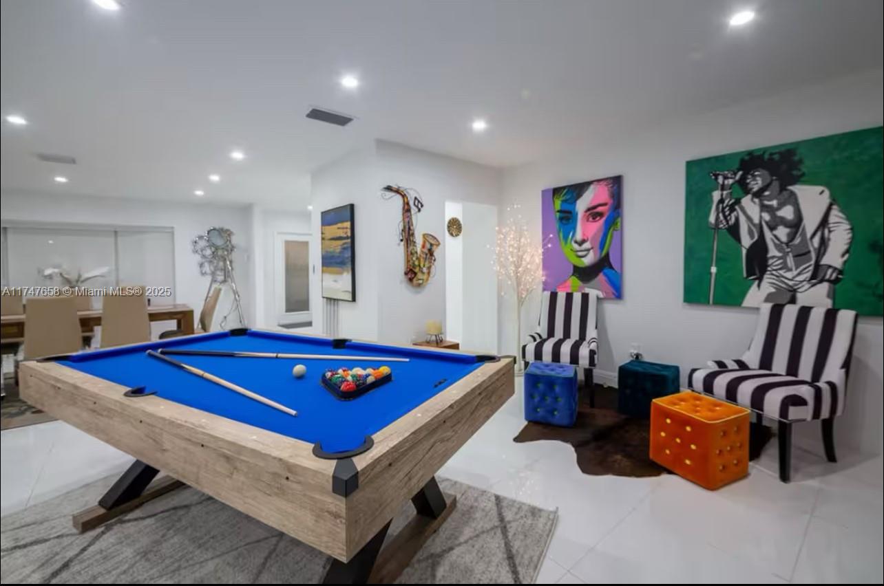 2271 Northeast 191st Street Miami, FL 33180 - Photo 9 of 24 a living room with furniture and pool table