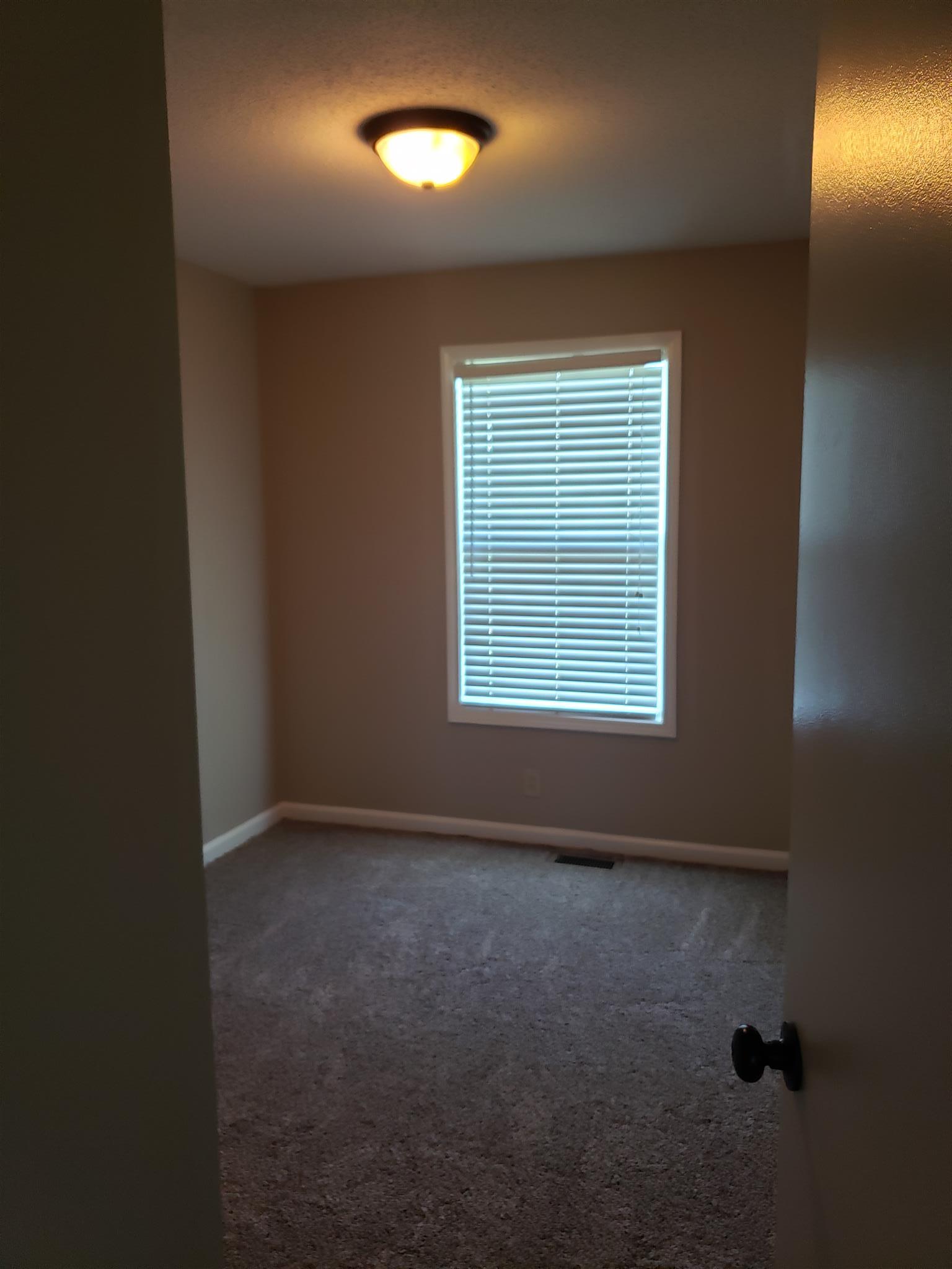 113 Waterford Drive Oak Grove, KY 42262 - Photo 11 of 13 an empty room with a window