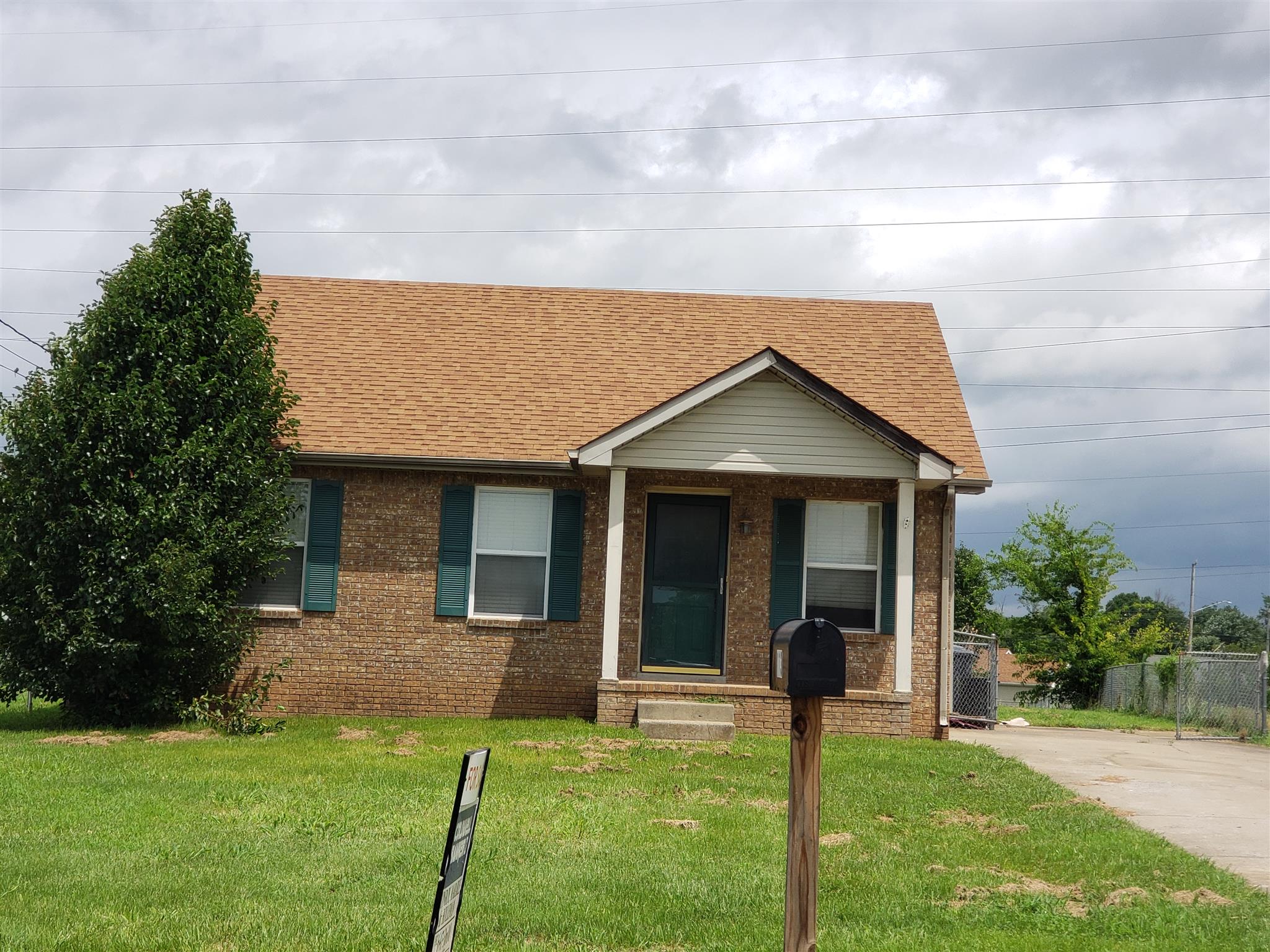 113 Waterford Drive Oak Grove, KY 42262 - Photo 2 of 13 a view of a house with a yard potted plants and a table
