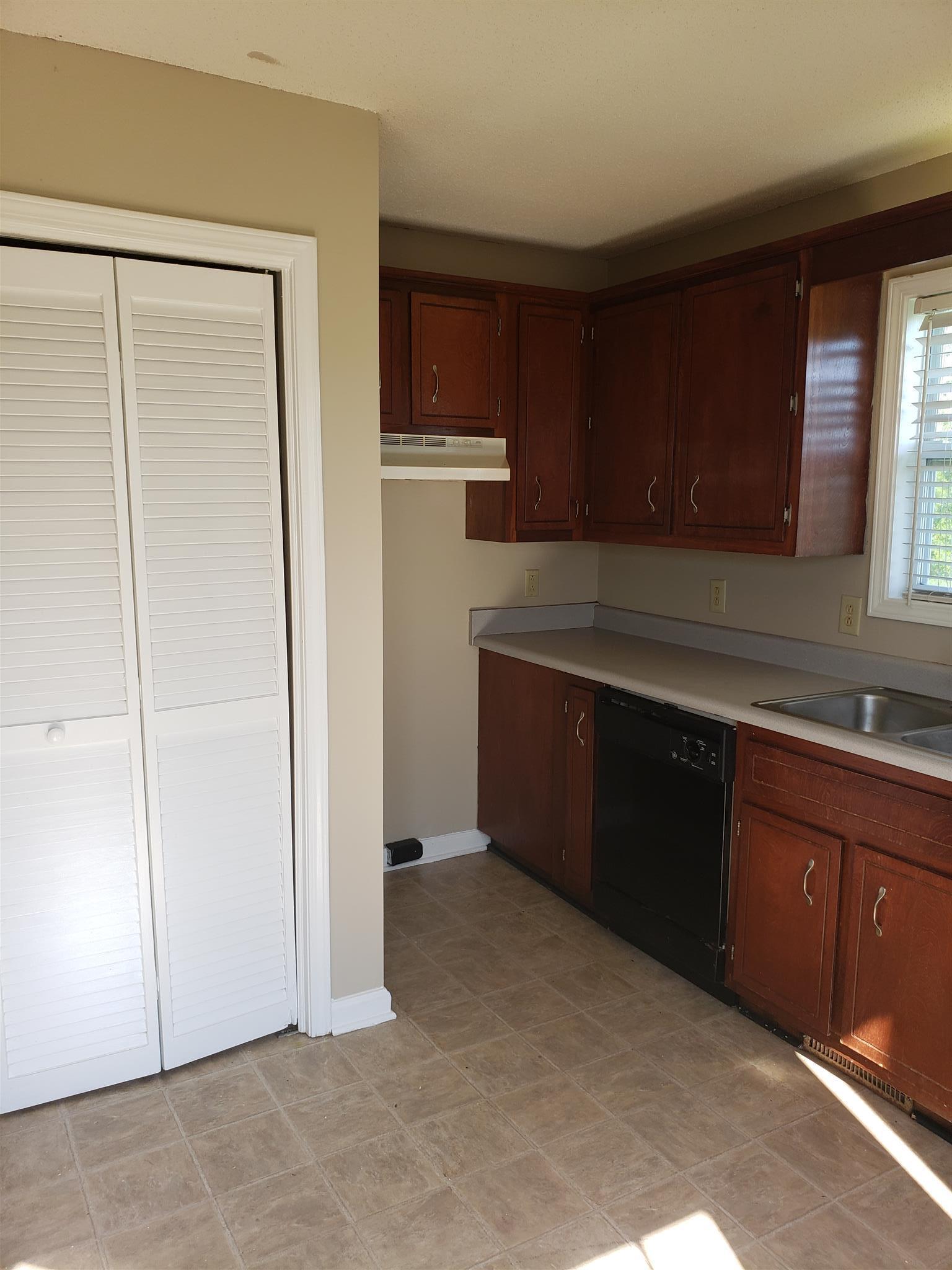 113 Waterford Drive Oak Grove, KY 42262 - Photo 4 of 13 a kitchen with kitchen island a counter top space and a sink