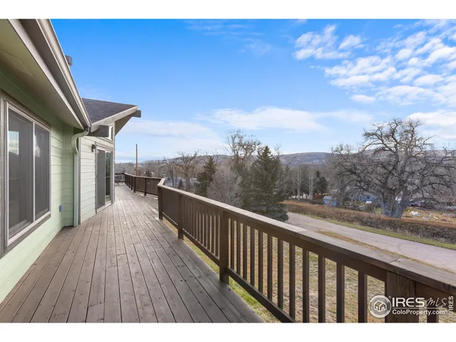 a view of balcony with furniture