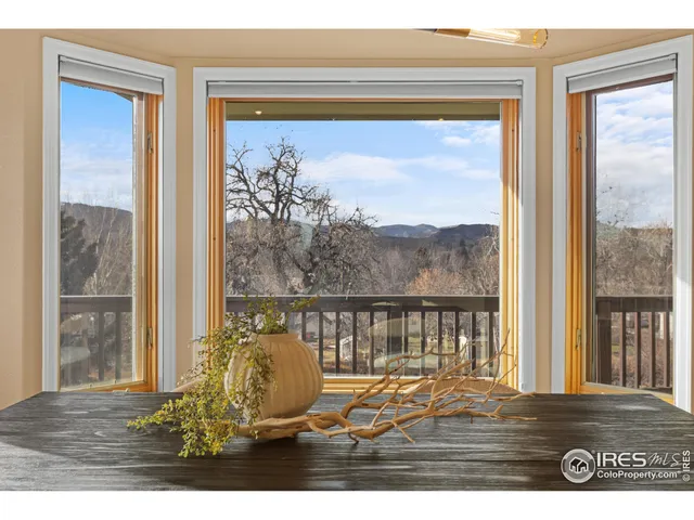 a view of a balcony with outside view