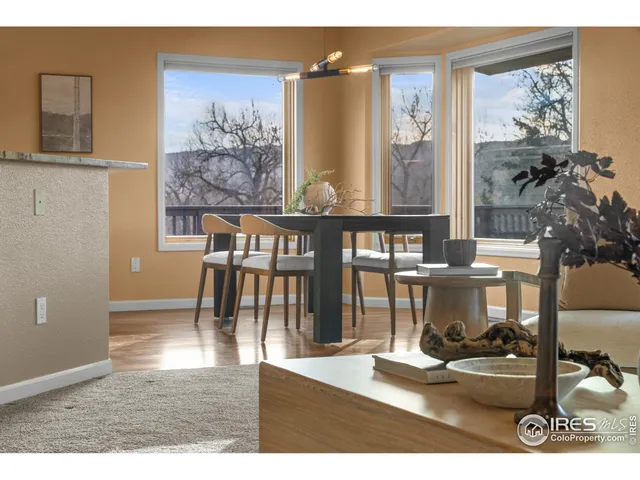 a view of a workspace with furniture and a potted plant