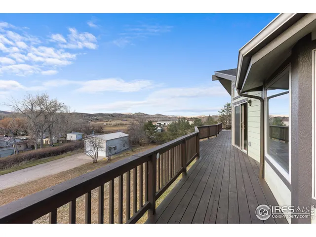 a view of balcony with furniture