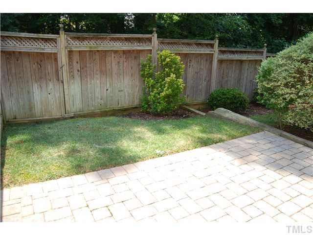 107 Nouveau Avenue Raleigh, NC 27615 - Photo 17 of 25 Private, fenced backyard with stone patio ideal for outdoor living and entertaining!
