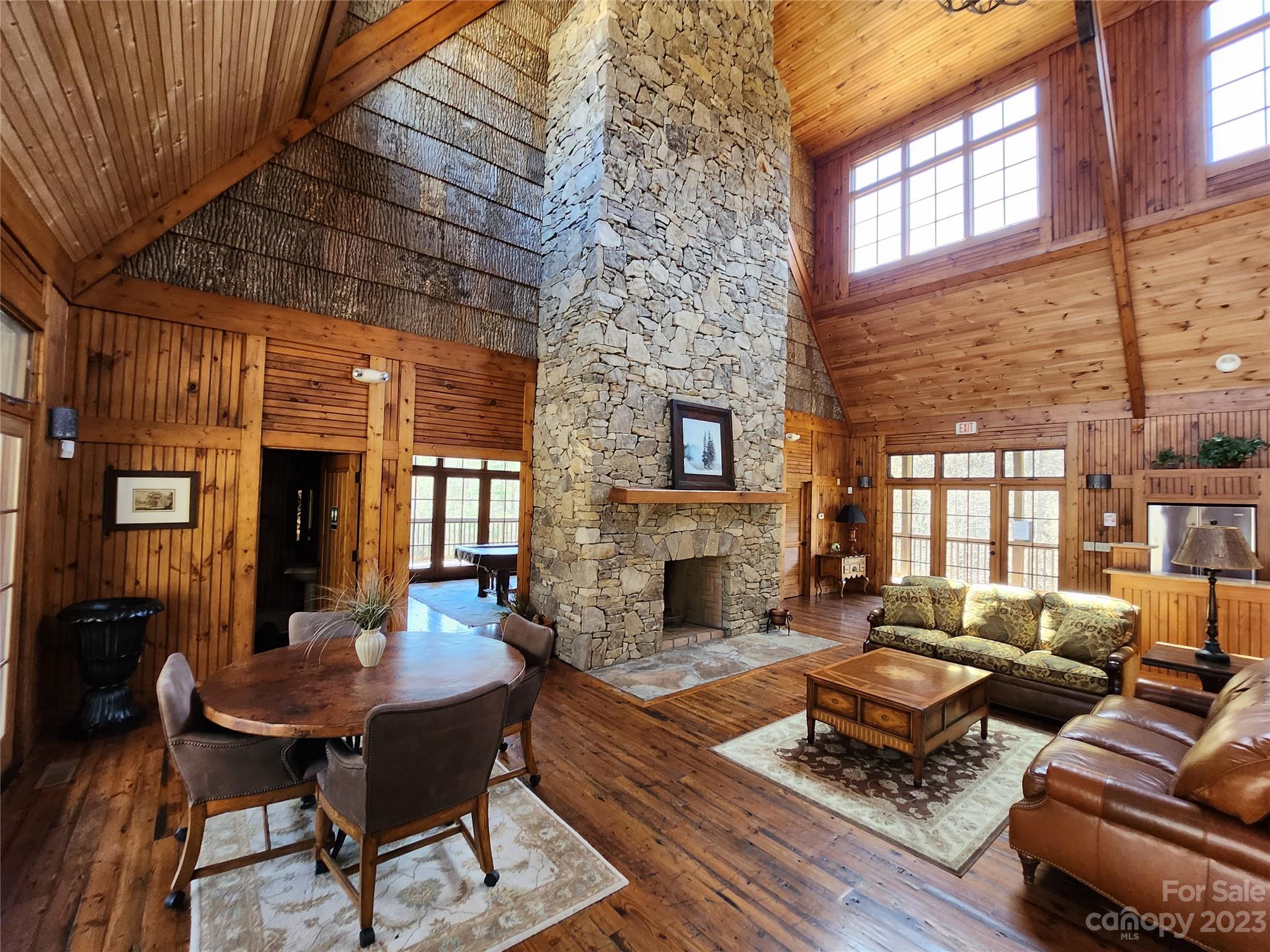 435 Pine Cone Trail Marshall, NC 28753 - Photo 19 of 34 a living room with furniture a fireplace and a table