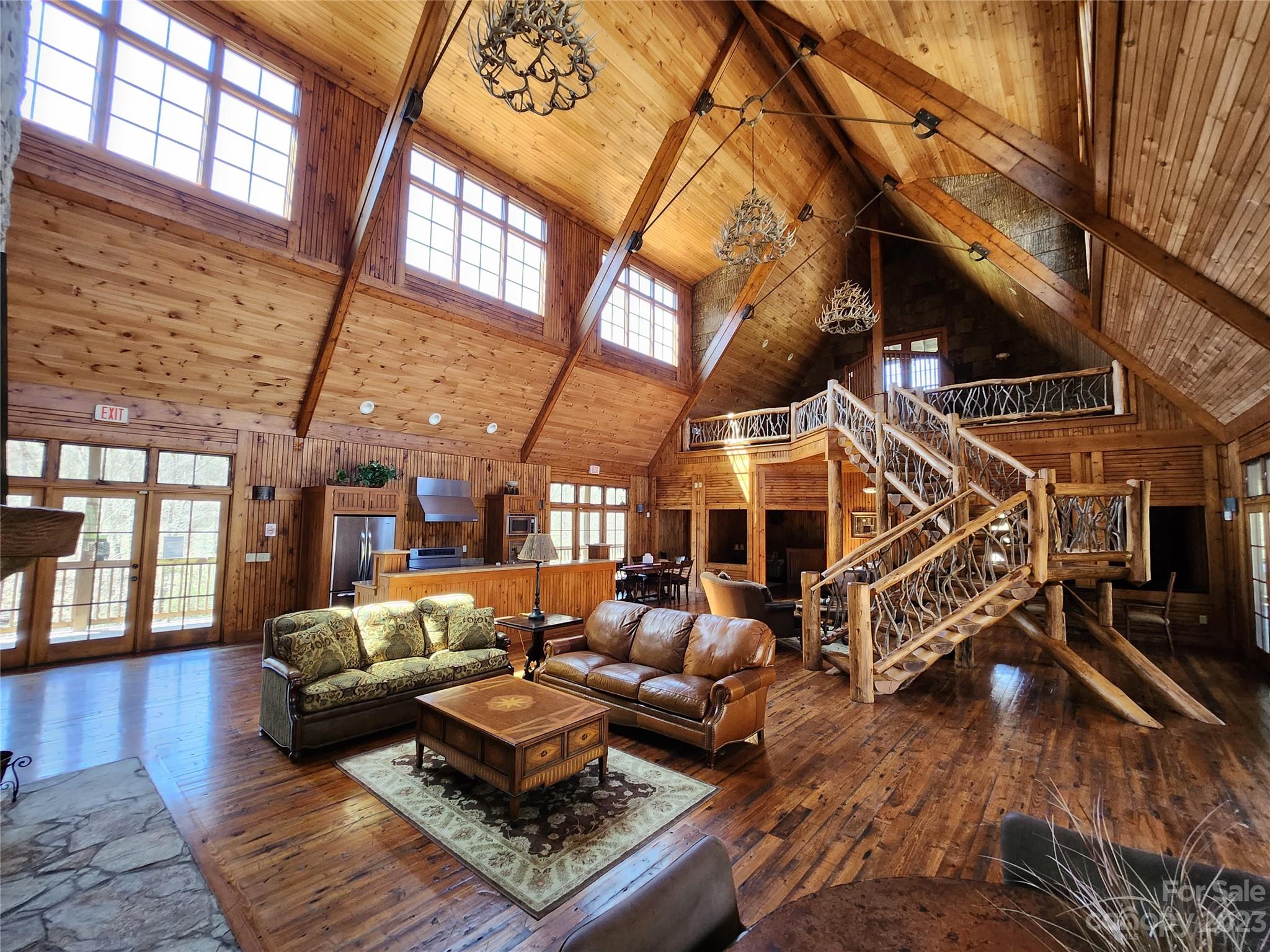 435 Pine Cone Trail Marshall, NC 28753 - Photo 20 of 34 a living room with furniture and a chandelier