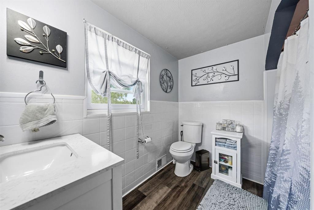 4768 Rolling Hills Road Pittsburgh, PA 15236 - Photo 22 of 46 a bathroom with a toilet sink and mirror