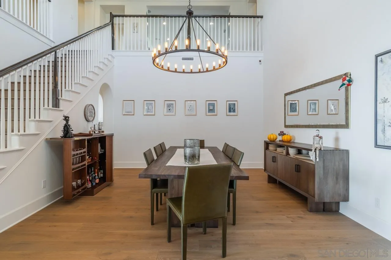 8749 Via Rancho Cielo Rancho Santa Fe, CA 92067 - Photo 17 of 30 a view of a dining room with furniture and chandelier