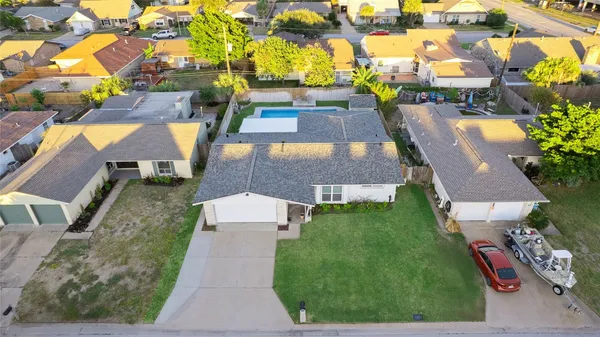 an aerial view of a house with a garden