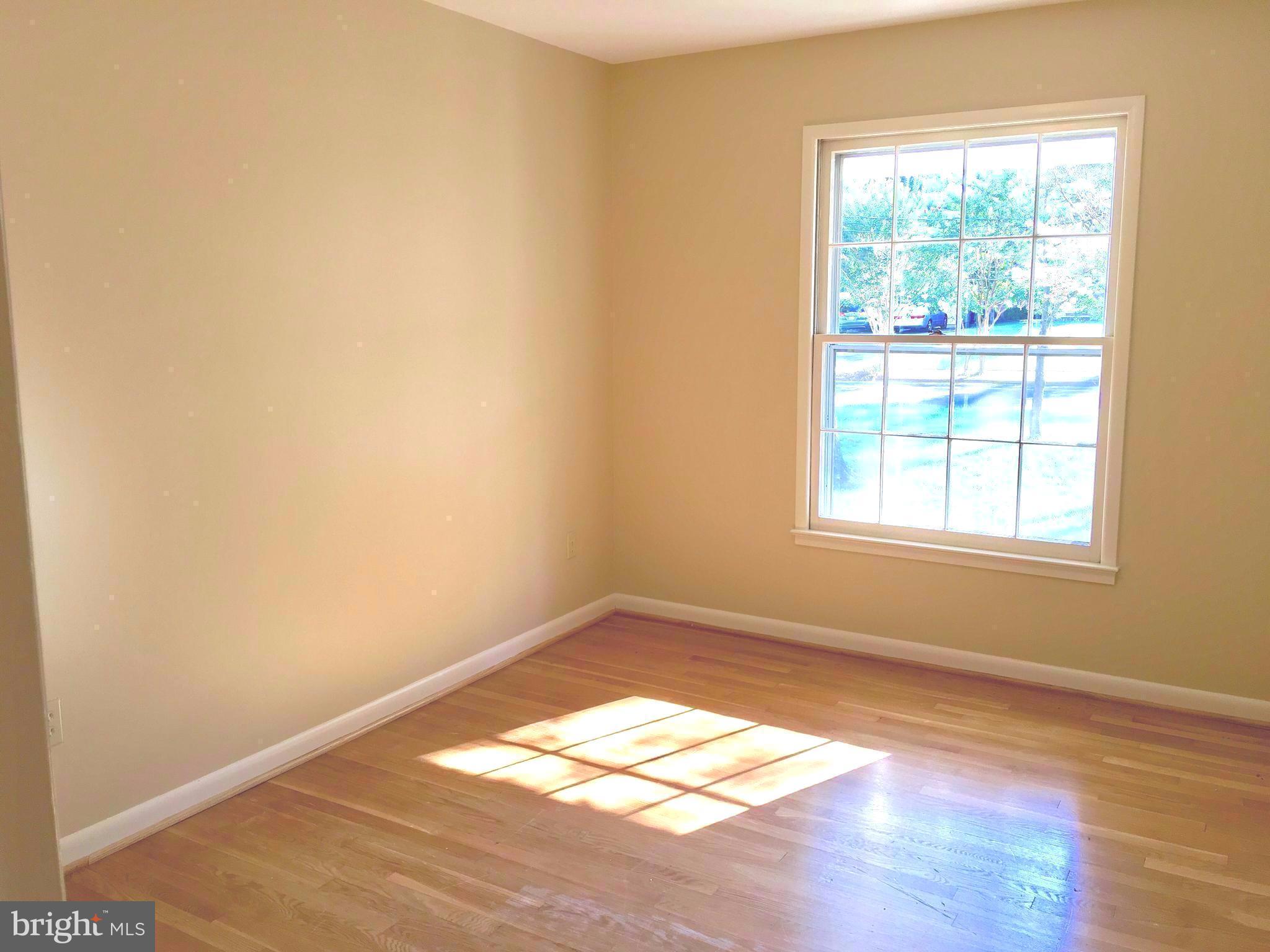 1003 Dead Run Drive McLean, VA 22101 - Photo 14 of 26 an empty room with wooden floor and windows